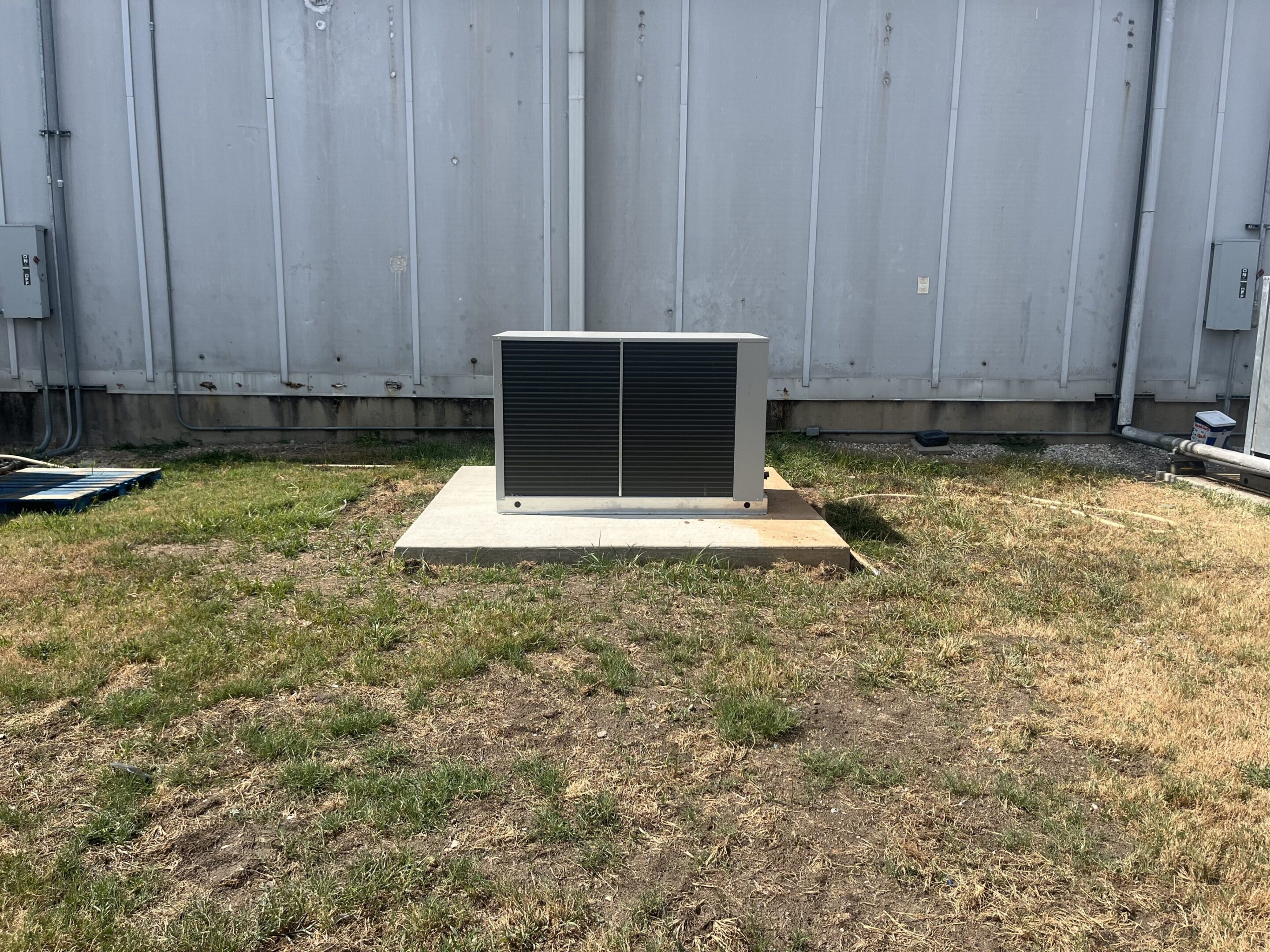 Outdoor HVAC unit on concrete pad