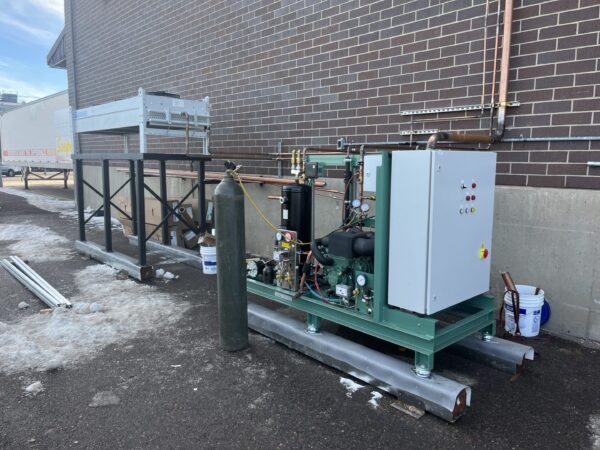 Outdoor industrial refrigeration compressor skid with cylinder