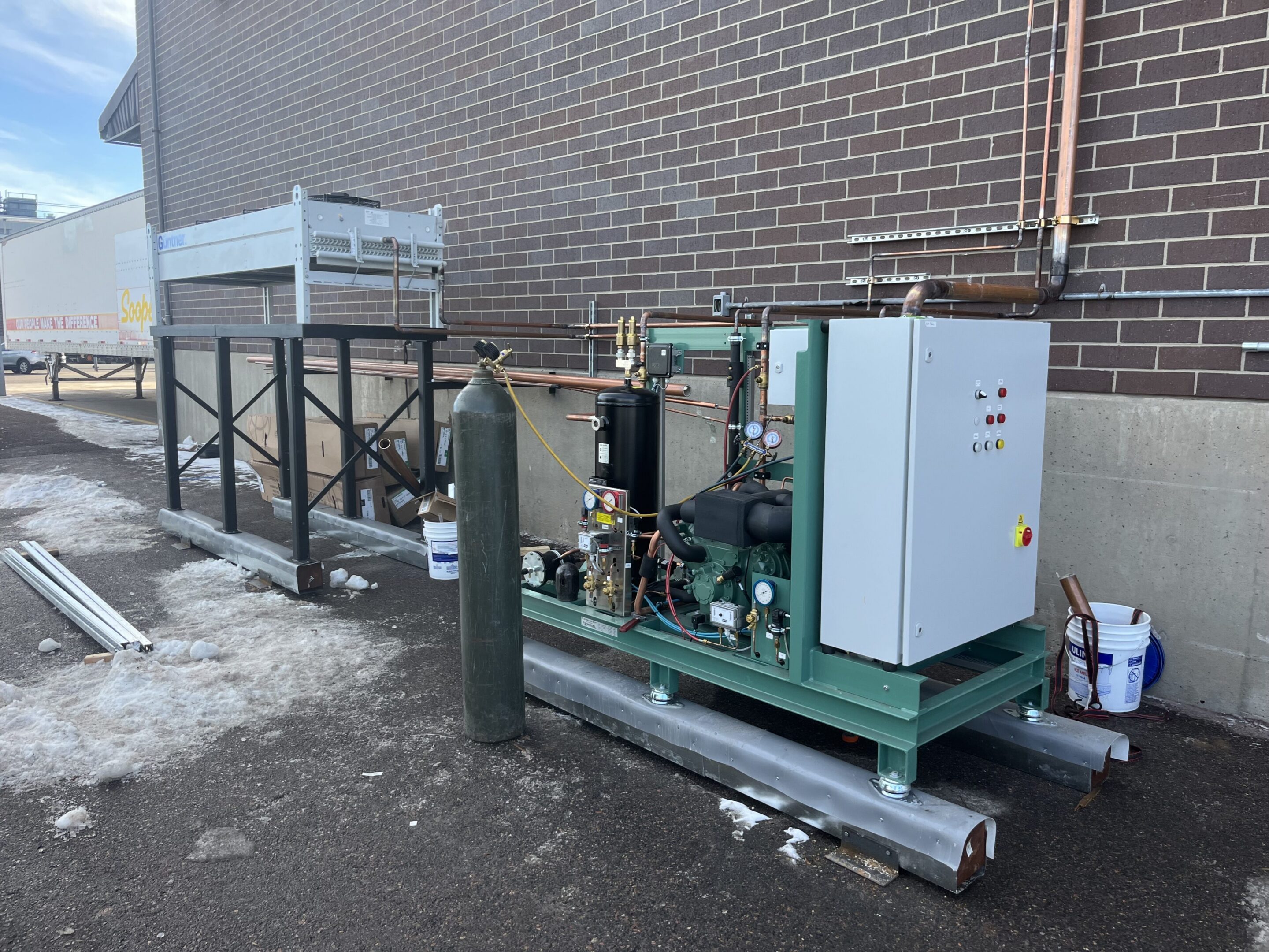 Outdoor industrial refrigeration compressor skid with cylinder
