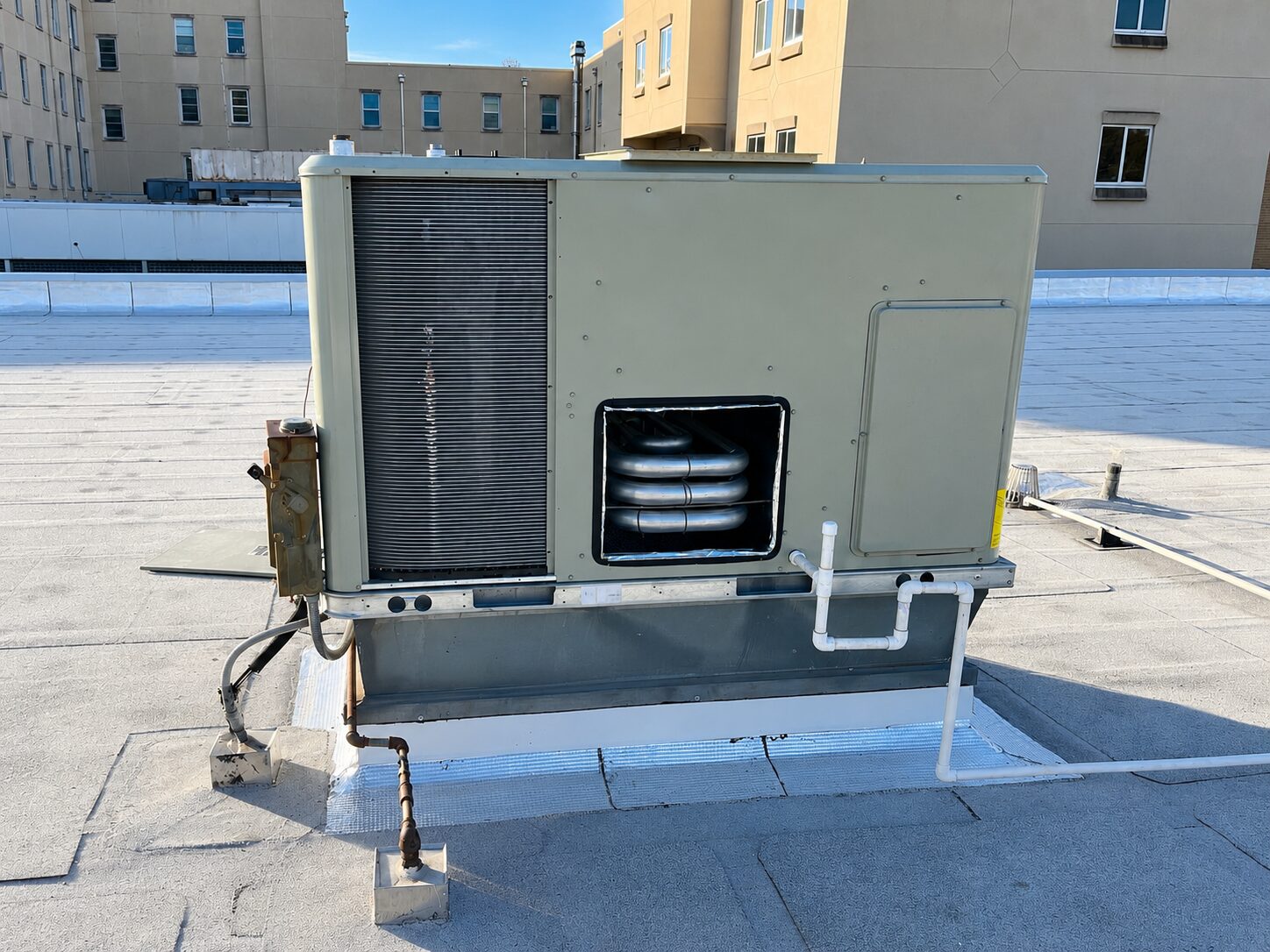 Rooftop air conditioning unit on flat roof