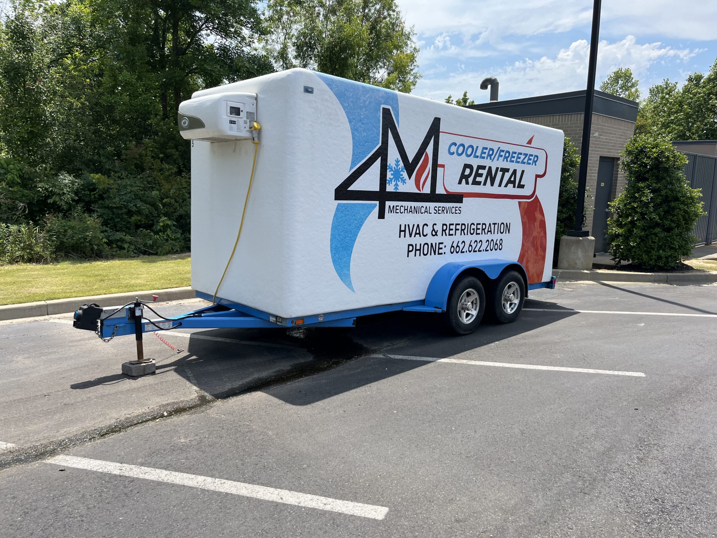 White cooler and freezer rental trailer